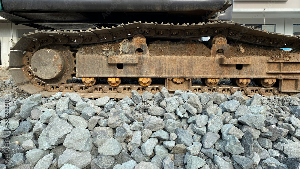excavator on gravel stones at a construction project site excavator on gravel stones at a construction project site