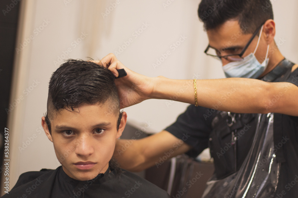 A boy in the barbershop A boy in the barbershop
