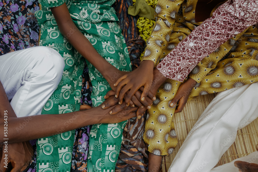 Nigerian family with hands over each other