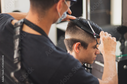 A boy in the barbershop