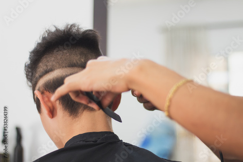 A boy in the barbershop