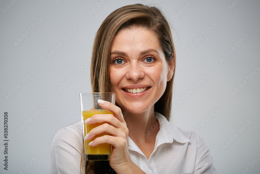 Smiling woman holding orange juice glass. Isolated female advertising portrait. Smiling woman holding orange juice glass. Isolated female advertising portrait.