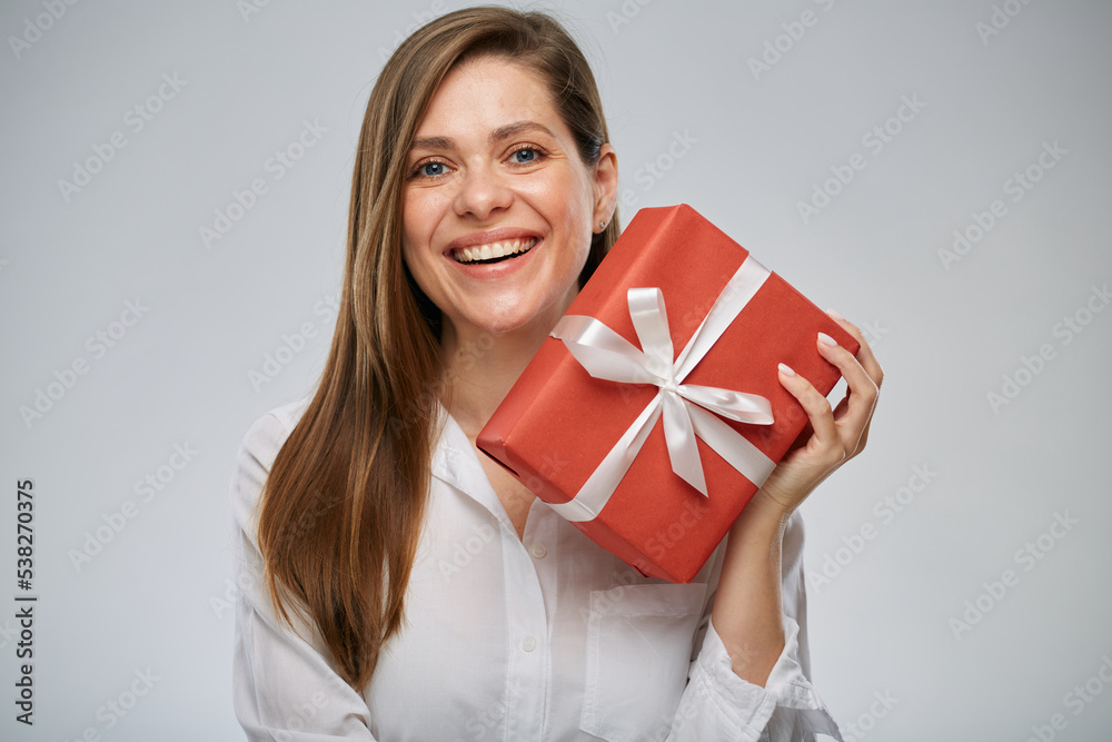 Happy woman holding gift box. Isolated female portrait. Happy woman holding gift box. Isolated female portrait.