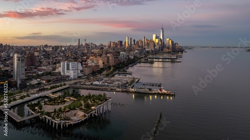 Aerial of the Little Island public park and New York City  skyscrapers on the Hudson river