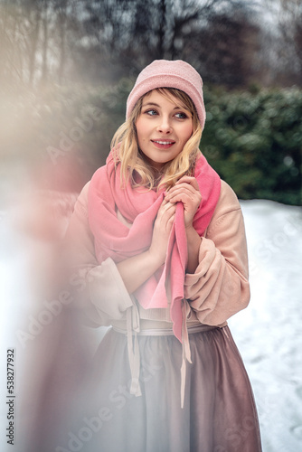 New Year's photos of a beautiful girl in the forest with a decorated Christmas tree, filled with comfort and magic