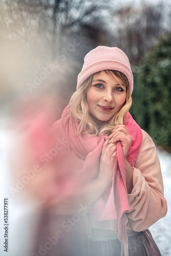 New Year's photos of a beautiful girl in the forest with a decorated Christmas tree, filled with comfort and magic