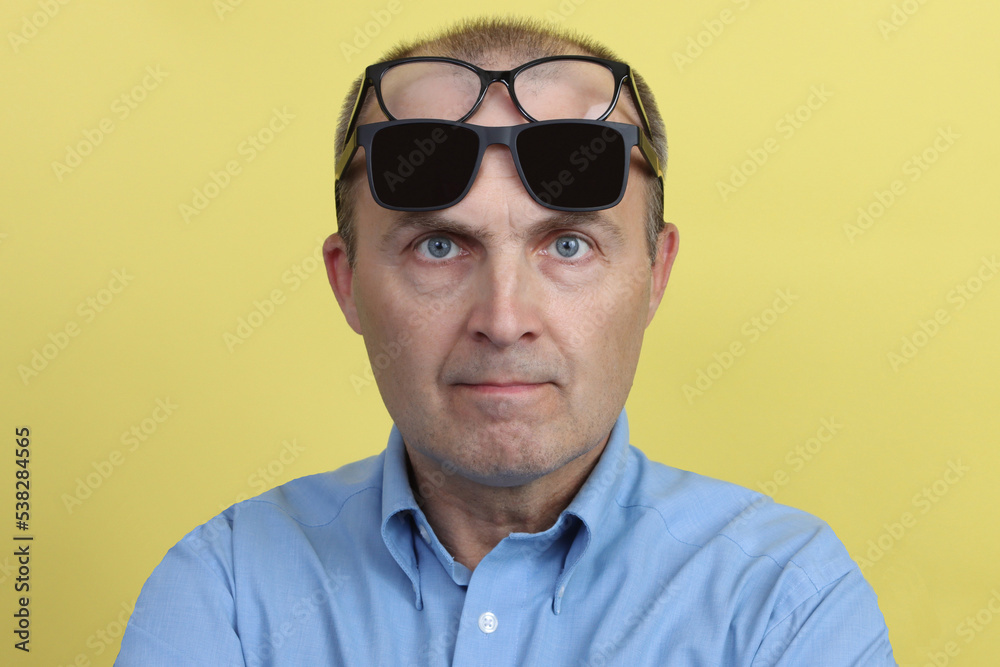 Close-up portrait of a handsome elderly man with glasses. Close-up portrait of a handsome elderly man with glasses.