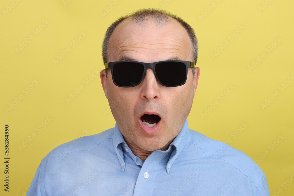 Portrait of a strongly surprised man with an open mouth in glasses. Portrait of a strongly surprised man with an open mouth in glasses.