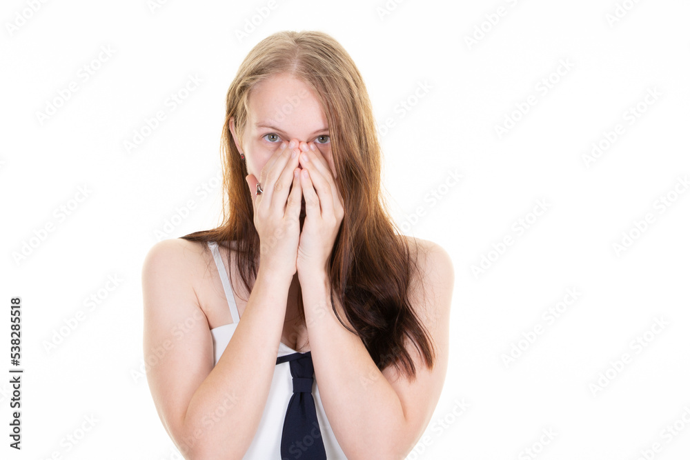 Young blonde woman hide face in hands blink through fingers frightened and nervous Young blonde woman hide face in hands blink through fingers frightened and nervous