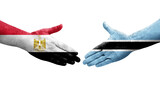 Handshake between Botswana and Egypt flags painted on hands, isolated transparent image.