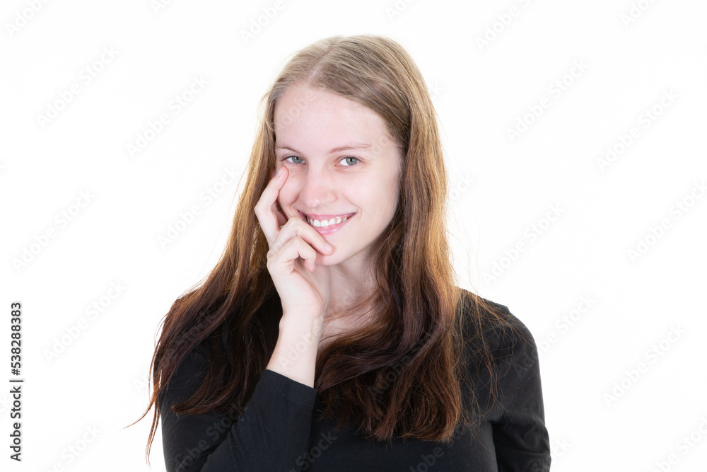young woman with finger mouth pensive aside copy space on white background young woman with finger mouth pensive aside copy space on white background