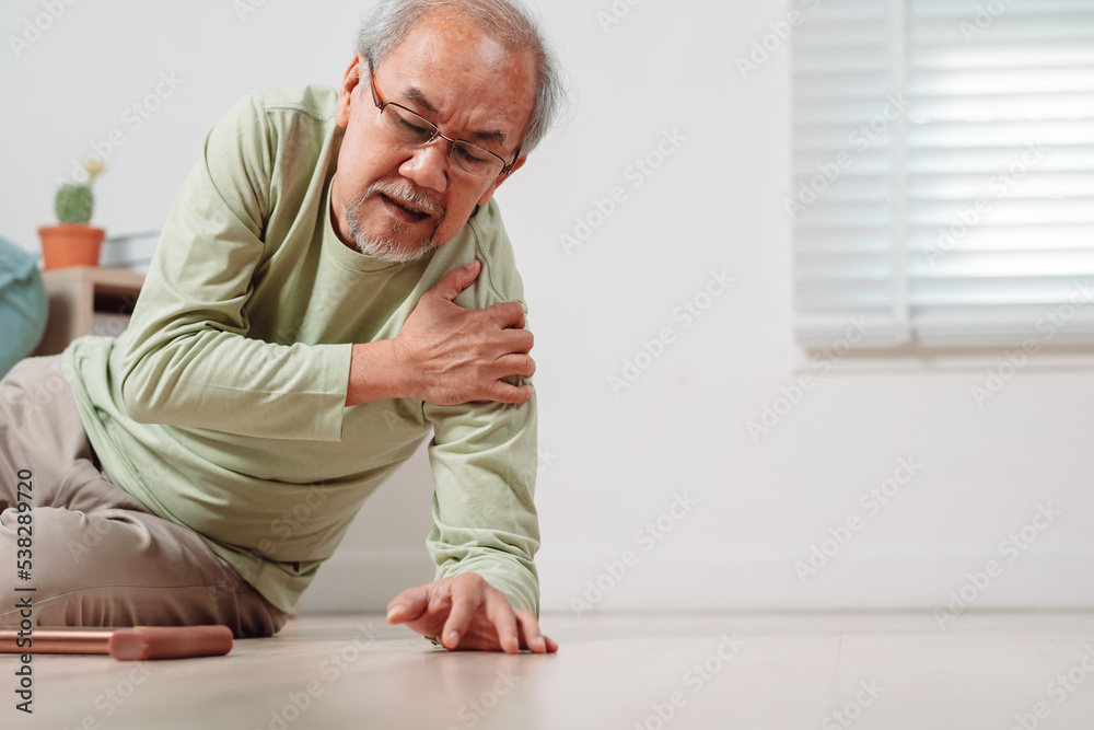 Asian senior man falling on the ground with walker in living room at home. Elderly older mature male having an accident heart attack for emergency help support from hospital. Insurance health care. Asian senior man falling on the ground with walker in living room at home. Elderly older mature male having an accident heart attack for emergency help support from hospital. Insurance health care.