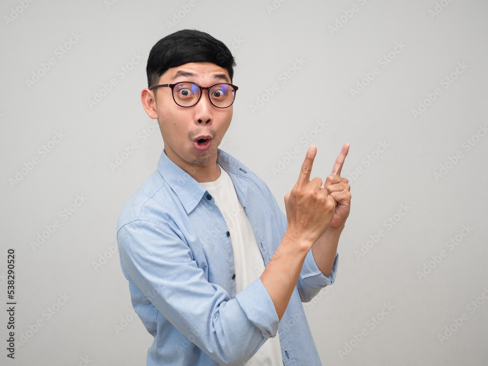 Young businessman wear glasses amazed gesture funny point finger at you isolated Young businessman wear glasses amazed gesture funny point finger at you isolated