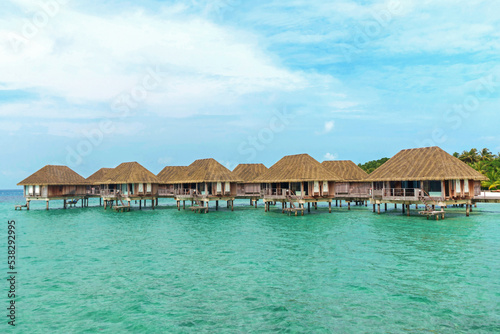 Fototapeta Naklejka Na Ścianę i Meble -  Exotic wooden villa on the water at Club Med Kani, a resort located on a very quiet and comfortable small island in the Maldives with stunning sea views