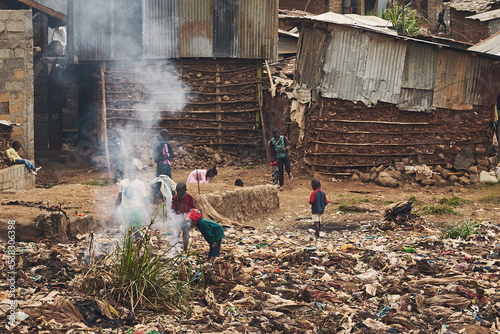 Children burning plastic trash in Kibera slum. photo