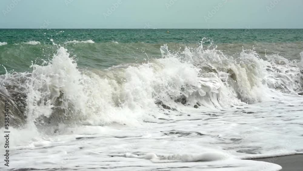 Slow motion video of waves crashing on a beach Slow motion video of waves crashing on a beach