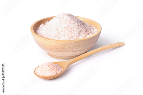 Pink himalayan salt in wooden bowl and spoon isolated on white background. 