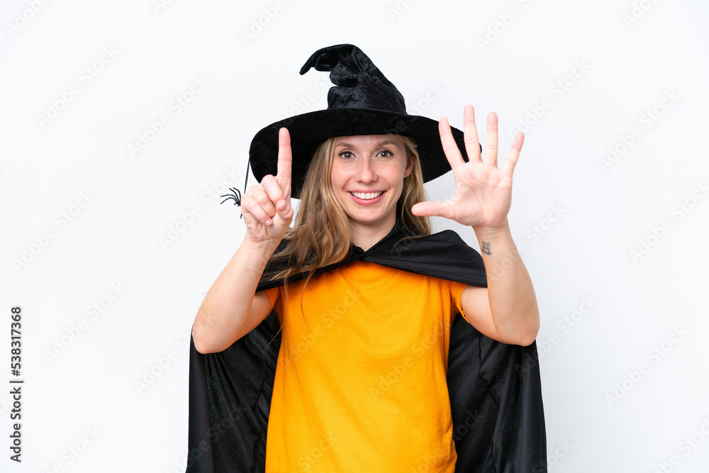 Young blonde woman dressed as a witch isolated on white background counting six with fingers Young blonde woman dressed as a witch isolated on white background counting six with fingers