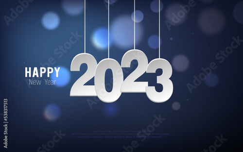 Happy New Year 2023. Hanging paper cut number and bokeh bubber on blue gradient background. photo