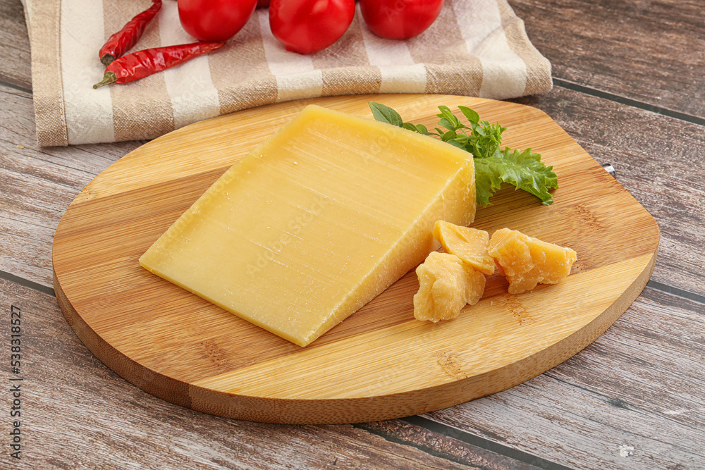 Parmesan hard cheese with small pieces Parmesan hard cheese with small pieces