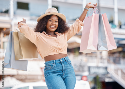 Shopping, fashion and retail, a black woman with a smile outside mall. Happy customer after discount sale at the shopping mall, city girl smiling with designer boutique bags and fun on summer holiday