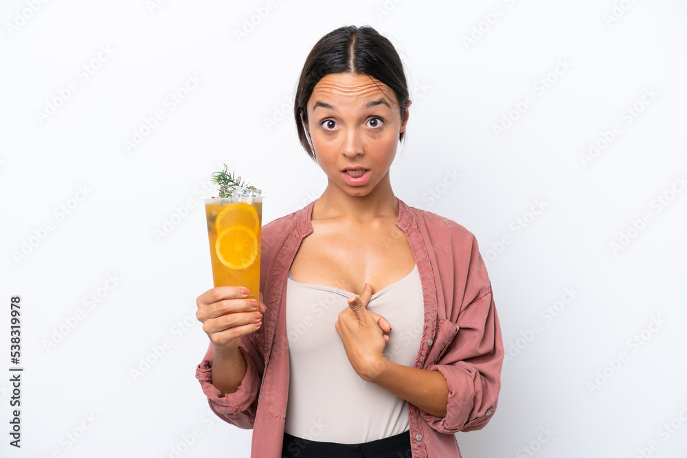 Young hispanic woman holding a cocktail isolated on white background with surprise facial expression Young hispanic woman holding a cocktail isolated on white background with surprise facial expression