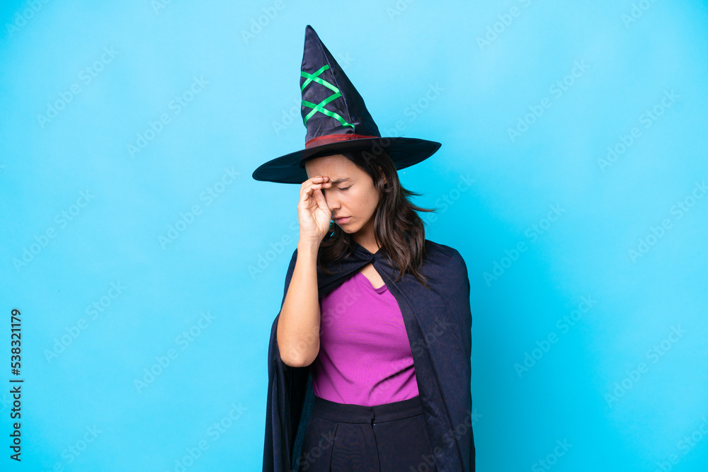 Young hispanic woman dressed as witch over isolated background with tired and sick expression