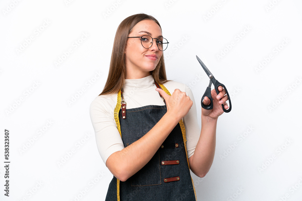 Young seamstress woman isolated on white background proud and self-satisfied Young seamstress woman isolated on white background proud and self-satisfied