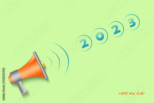 2023 and a megaphone on a green background. New year concept. copy space. Holidays.