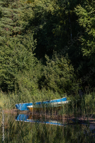 Two rowing boats on a sandy beach among the reeds in Repovesi National Park, Finland