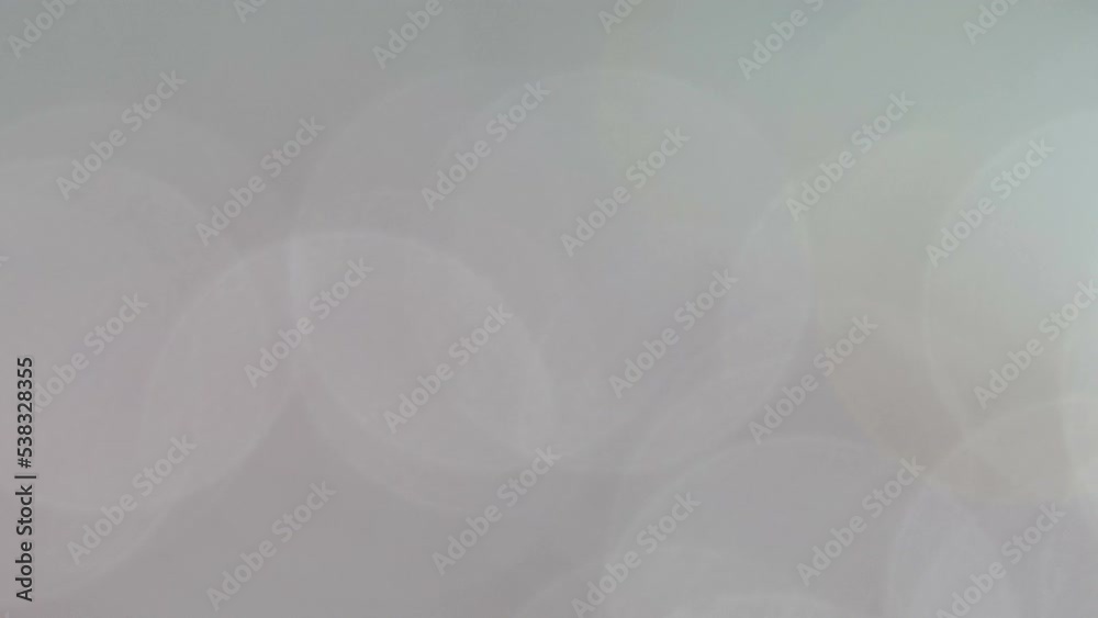 Opaque grey bokeh wallpaper panning downwards