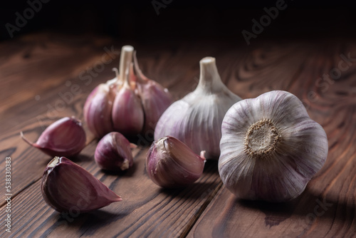 Garlic bulb on wooden background. Close up