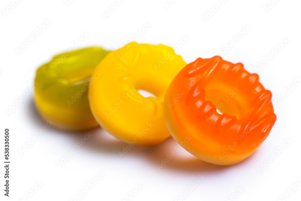 Multicolored jelly candy donuts on a white background Multicolored jelly candy donuts on a white background