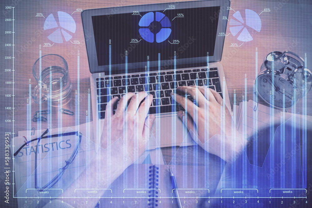 Double exposure of man's hands typing over laptop keyboard and forex chart hologram drawing. Top view. Financial markets concept. Double exposure of man's hands typing over laptop keyboard and forex chart hologram drawing. Top view. Financial markets concept.