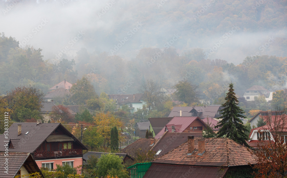 Landscape with fog over the village