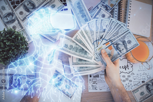 Multi exposure of vr glasses drawing hologram and USA dollars bills and man hands.