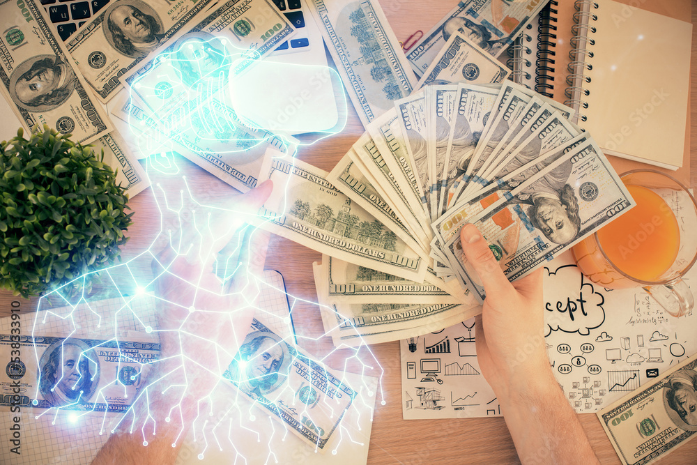 Multi exposure of vr glasses drawing hologram and USA dollars bills and man hands. Multi exposure of vr glasses drawing hologram and USA dollars bills and man hands.