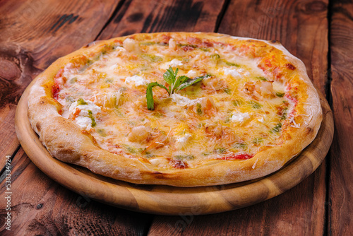 Shrimp pizza with different types of cheese