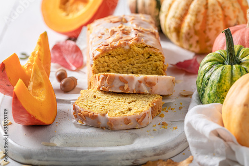 Tasty pumpkin pound cake surrounded with leaves and acorns.