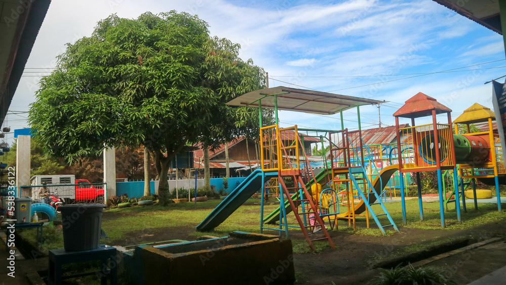 Tondano, Indonesia - October 10, 2022, children playing in the early childhood school playground