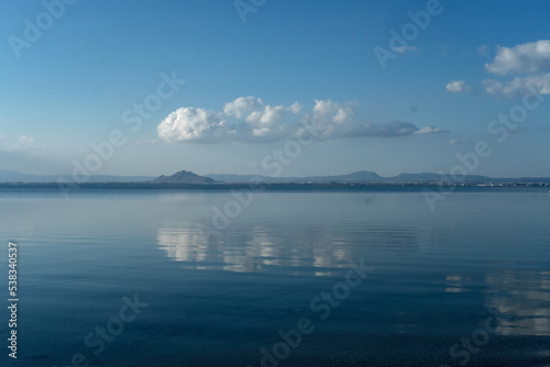 single cloud reflected in calm sea © Max