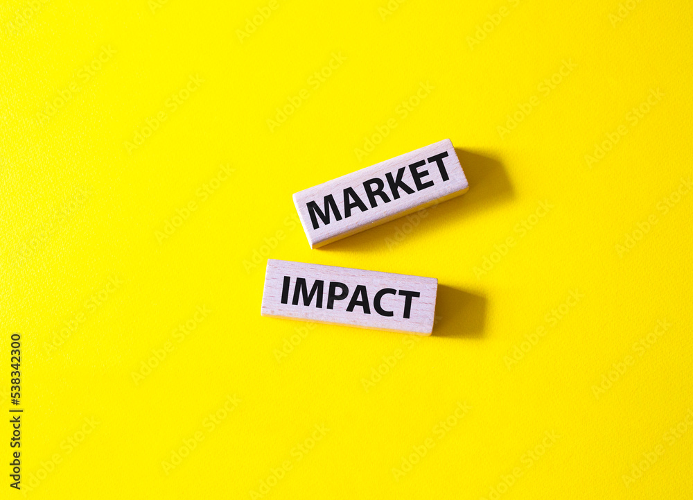 Market impact. Concept word Market impact on wooden cubes. Beautiful yellow background. Business and Market impact concept. Copy space. Market impact. Concept word Market impact on wooden cubes. Beautiful yellow background. Business and Market impact concept. Copy space.