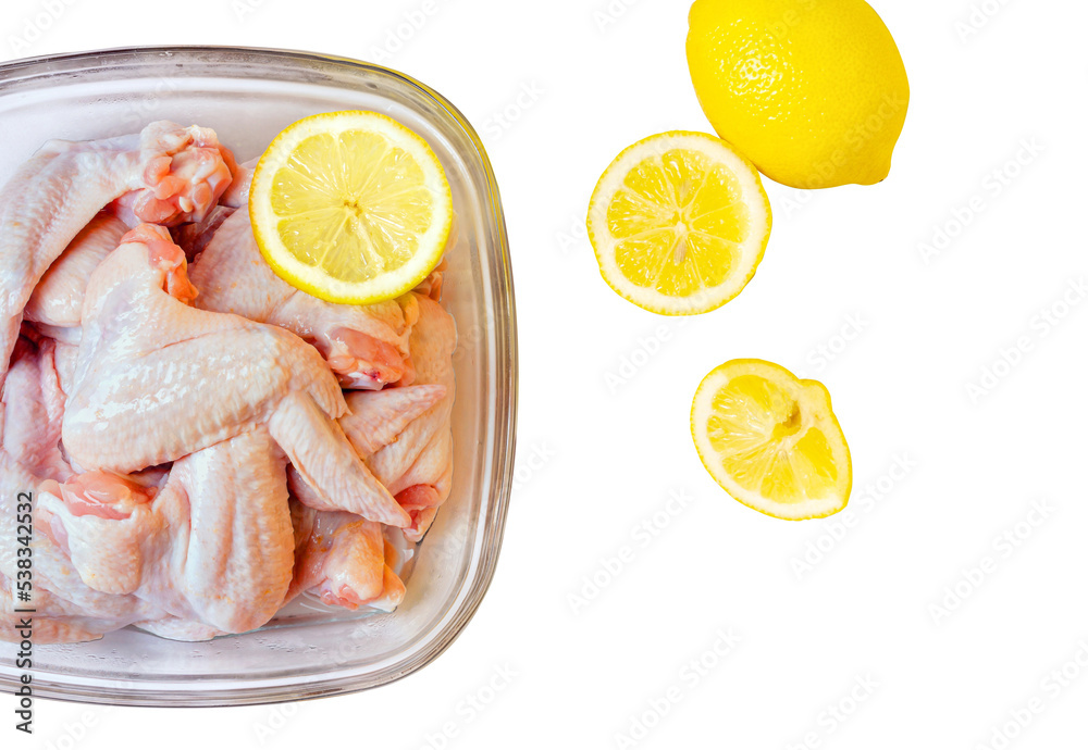 Raw chicken wings in glass bowl isolated on white background with clipping path. Raw chicken wings in glass bowl isolated on white background with clipping path.