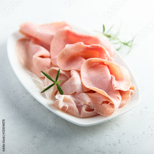 Traditional smoked ham on a white plate