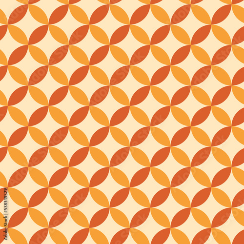 Mid century modern geometric circles seamless pattern in orange and yellow. For wallpaper, home décor and fabric  