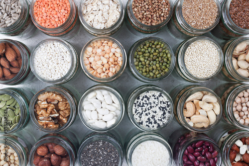 Vegan protein source. assortment of healthy vegetarian food. top view of seeds, nuts, beans, rice, spelt, peas, oatmeal on white background