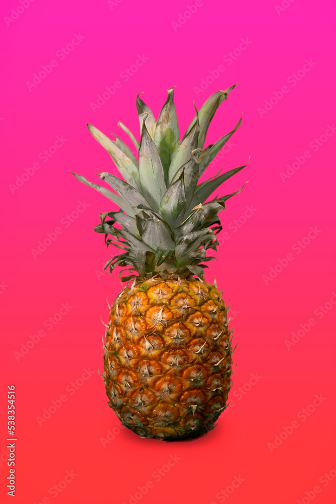 Ripe pineapple on pink background Ripe pineapple on pink background
