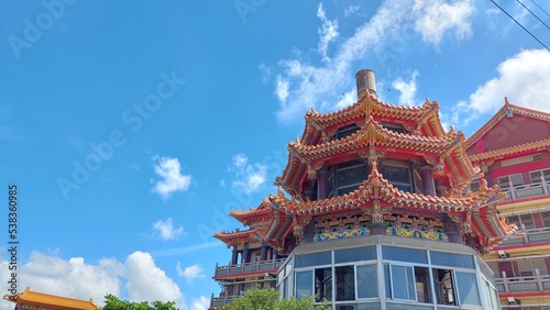 religious oriental sculpture on the roof of Taiwan temple with blue sky design for holy and belief concept