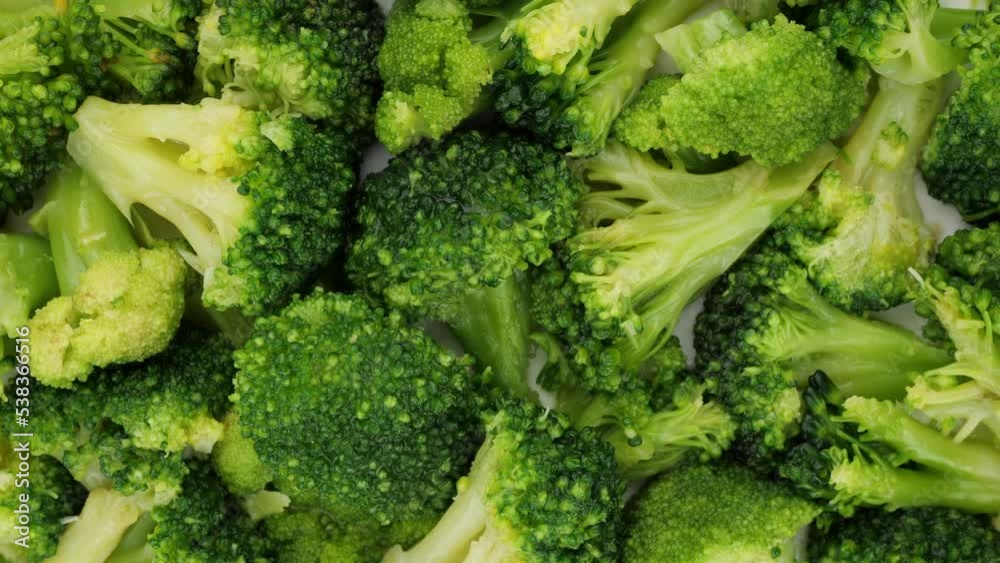 Fresh broccoli top view, rotation. Chopped broccoli. Healthy food concept Fresh broccoli top view, rotation. Chopped broccoli. Healthy food concept
