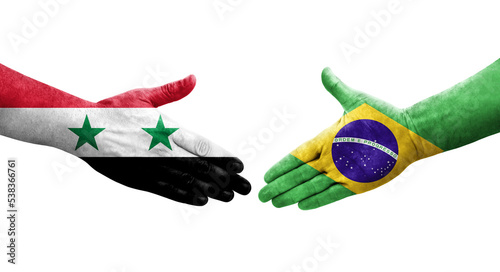 Handshake between Brazil and Syria flags painted on hands, isolated transparent image. photo